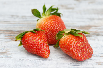 Strawberries lying on wood