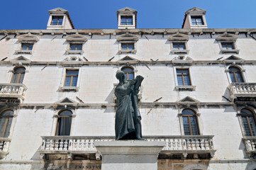 Milesi Palace and Statue of Marko Marulic, famed Croatian poet, humanist and writer. Split, Croatia.