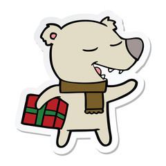 sticker of a cartoon bear with present