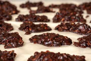 Closeup of a batch of fresh chocolate no-bake cookies, also called cow patties.