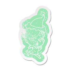cartoon distressed sticker of a surprised girl wearing santa hat