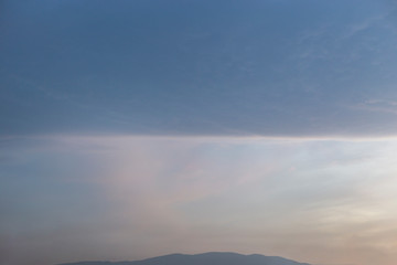 Straight line cloud spliting the sky