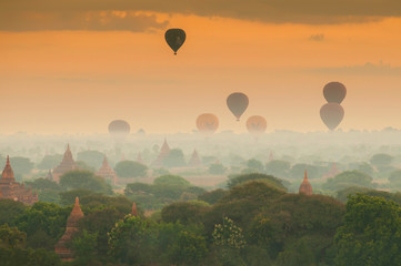 Hot air balloon over plain of Bagan in misty morning, Myanmar.