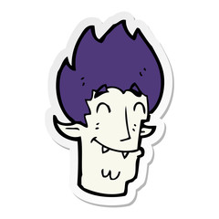 sticker of a cartoon happy vampire head