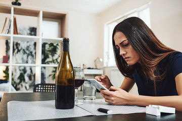 When the past calls, let it go to voicemail. It has nothing new to say. Young woman alcoholic, smoker, social problems concept, sitting, smoking cigarette
