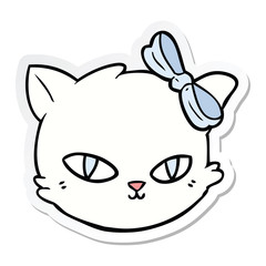 sticker of a cartoon cat wearing bow