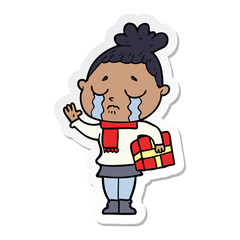 sticker of a cartoon crying woman with christmas gift