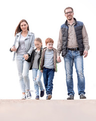 modern family with two children walking together