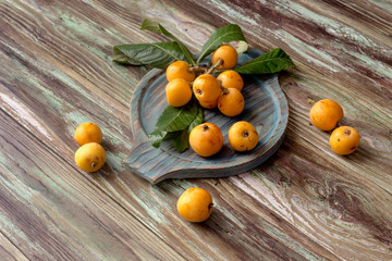 loquat on a wooden background