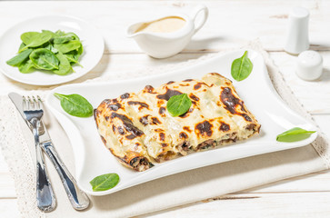 Cannelloni with minced beef and spinach baked in béchamel sauce. 