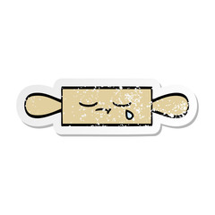 distressed sticker of a cute cartoon rolling pin