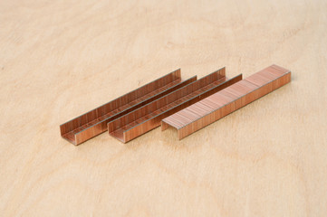 brackets construction on a wooden background