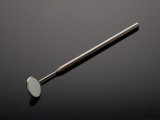 Professional dental mirror. Dental health concept