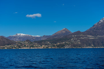 Italy, Bellagio, Lake Como with snow capped alps mountain