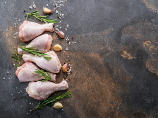 Chicken legs with spices and salt  ready for cooking.