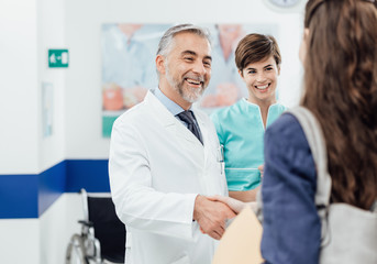 Doctor welcoming a patient at the clinic