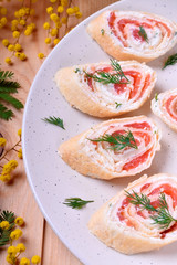 Crepes rolls with cream cheese and salmon cut into pieces