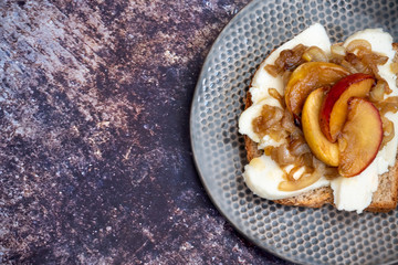Breakfast, top view, copy space. Sandwich with cheese and caramelized apples.