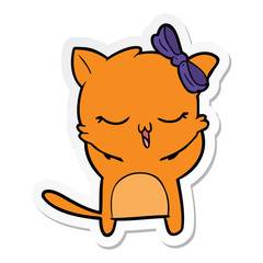sticker of a cartoon cat with bow on head