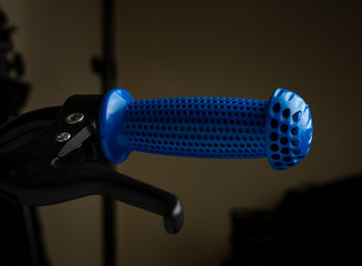 Close up capture of blue handle bar of bicycle