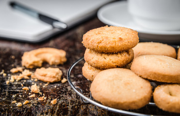 Chocolate chip cookies Closeup with cup and Diary book on wooden tabel.