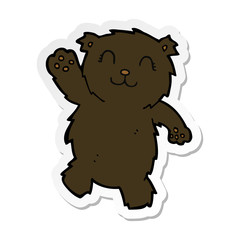 sticker of a cartoon waving black bear