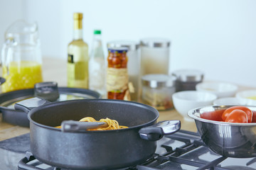 Composition with wooden board and ingredients for cooking on table