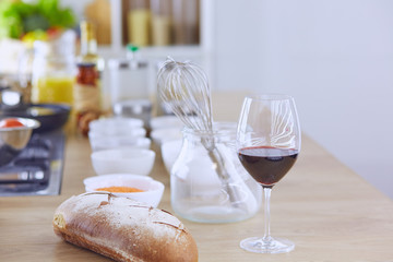 Composition with wooden board and ingredients for cooking on table