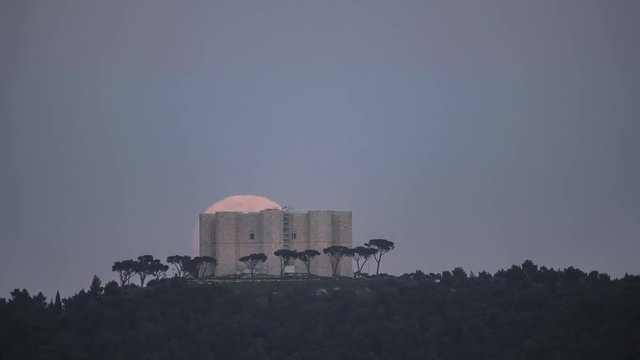 moon rising behind Castel Del Monte