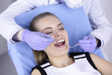 beautiful girl in the dental chair on the examination at the dentist