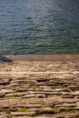 Italy, Bellagio, Lake Como, a rocky beach next to the water