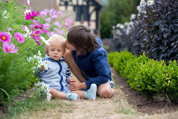 Beautiful child in amazing flower garden