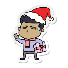 sticker cartoon of a man sweating wearing santa hat