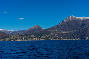 Italy, Bellagio, Lake Como with snow capped alps mountain