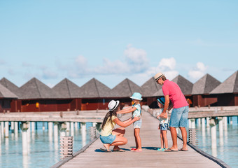 Happy family on a beach during summer vacation