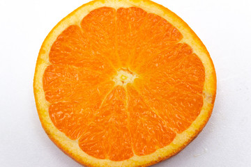 Orange slice on white background. Macro