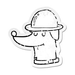 distressed sticker of a cartoon dog wearing hat