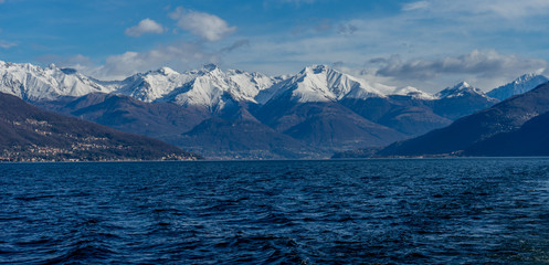 Italy, Bellagio, Lake Como with snow covered peaks background