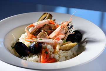 Rice with seafood on a plate in restauant ready to be served