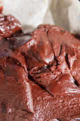 Prepared dough for dessert chocolate brownie before baking