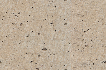 concrete surface with small patches of light natural color, seamless texture