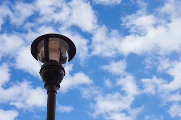 old street lamp on blue sky