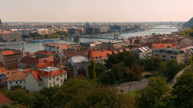 Panning shot of the Buda district in Budapest, Hungary lit by beautiful morning sunlight