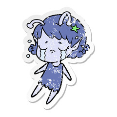 distressed sticker of a cartoon crying alien girl