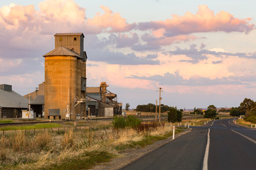 Fototapeta na wymiar Silo along a railway line for agricultural grain storage in outback Australia.