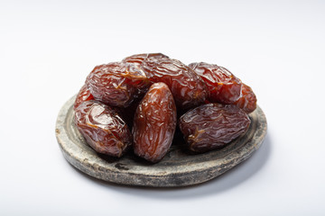 Pile of sweet tasty dried dates fruits close up isolated