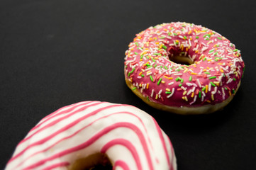Picture of donuts  frosted, pink glazed and sprinkles donuts isolated on white background