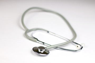 Medical stethoscope on the white background. Selective focus. 
