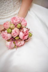 Bride holding flower bouquet 