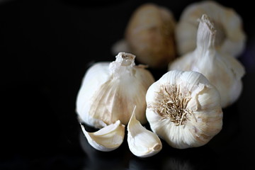 raw garlic clove on a table in the kitchen